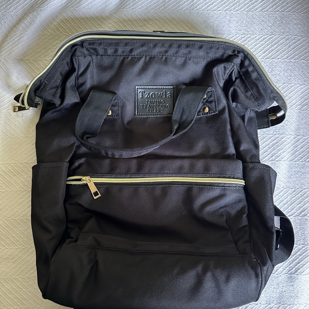 Black Travel Backpack with Gold Zippers